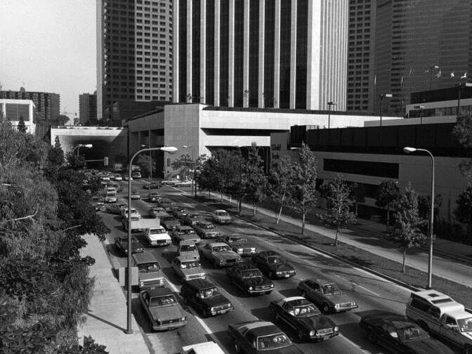3rd Street looking east toward Flower Street and the 3rd Street Tunnel. Office towers are seen on Bunker Hill in 1995.
