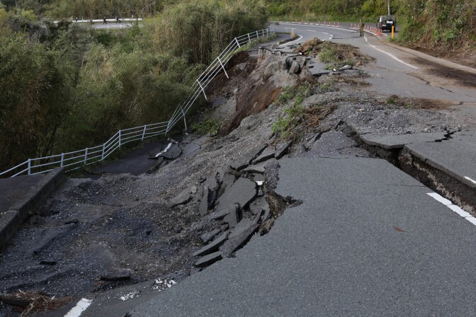 KUMAMOTO, JAPAN - APRIL 17:  A road collapse and landslide are seen on April 17, 2016 in Kumamoto, Japan. A magnitude-7.3 earthquake hit Kumamoto prefecture on Japan's Kyushu Island on Saturday after one measuring 6.4 struck on Thursday. As of Sunday, reports indicate that 42 people have been killed, 1,500 were injured, and 11 people remain missing. An estimated 80,000 homes are without power and 400,000 homes have no running water.  (Photo by Taro Karibe/Getty Images)