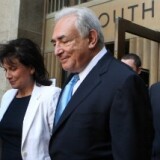 Former International Monetary Fund leader Dominique Strauss-Kahn (C) and his wife Anne Sinclair (2nd L) leave New York State Supreme Court for a hearing July 1, 2011 in New York City.