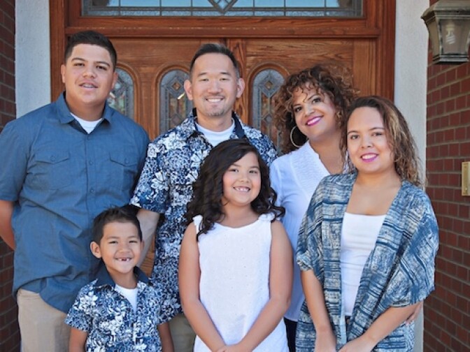 Sonia Smith Kang (back row right) poses with her multiracial, multicultural family. She is Mexican-black, and her husband is Korean.