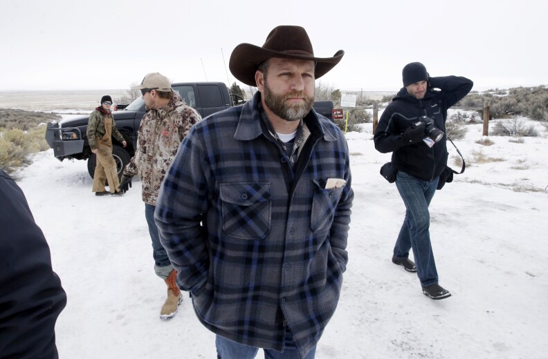 Ammon Bundy, one of the sons of Nevada rancher Cliven Bundy, arrives for an interview at Malheur National Wildlife Refuge, Tuesday, Jan. 5, 2016, near Burns, Ore. Law enforcement had yet to take any action Tuesday against a group numbering close to two dozen, led by Bundy and his brother, who are upset over federal land policy. (AP Photo/Rick Bowmer)