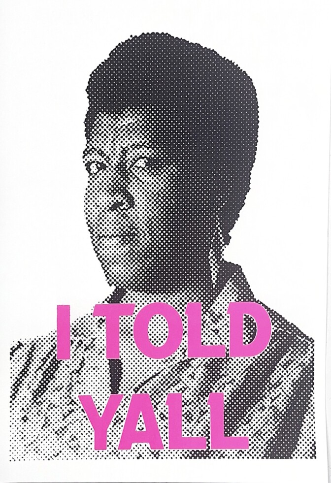 A dark skinned woman with short hair is looking at the camera. On it there are three words in pink: I TOLD Y'ALL.  