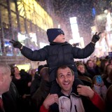 NEW YORK, NY - JANUARY 01:  Luis Tito, 6, celebrates atop the shoulders of his father, Jorge Tito, in Times Square just after the annual ball drop January 01, 2011 in New York City. This year a 11,875-pound Waterford crystal ball descended a 141-foot tall flagpole to mark the beginning of 2011.  (Photo by Brian Harkin/Getty Images) *** Local Caption *** Jorge Tito;Luis Tito