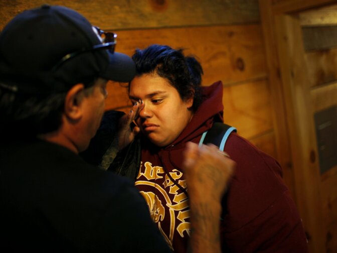 Jade Tapia, 14, cries as she says goodbye to her father just after arriving on the Wellspring campus in August. If students make enough progress in the first eight weeks, they earn the right to go home for the weekend or to go out to eat with their visiting families.