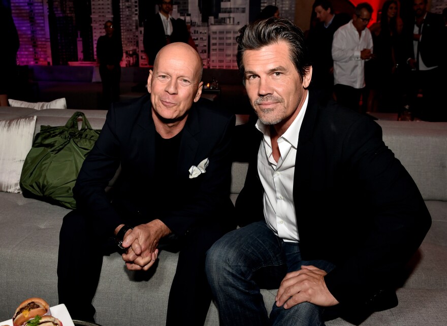 LOS ANGELES, CA - AUGUST 19:  Actors Bruce Willis (L) and Josh Brolin pose at the after party for the premiere of Dimension Films' "Sin City: A Dame To Kill For" at the Roosevelt Hotel on August 19, 2014 in Los Angeles, California.  (Photo by Kevin Winter/Getty Images)