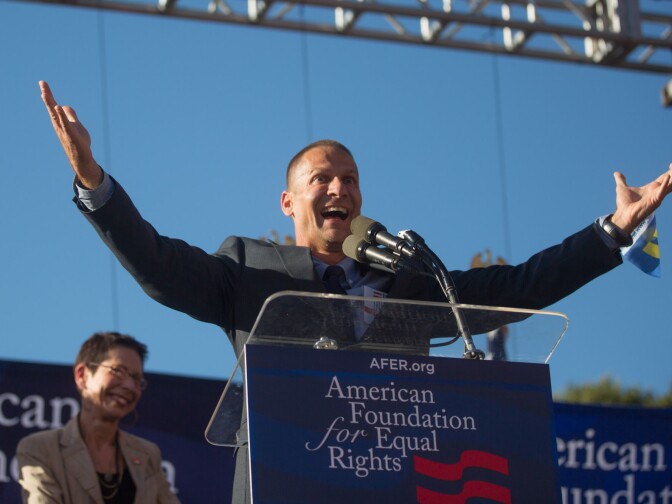 John D’Amico, mayor pro tempore of West Hollywood, cheers on the crowd as he takes the stage at a rally for two Supreme Court decisions legalizing gay marriage in California.