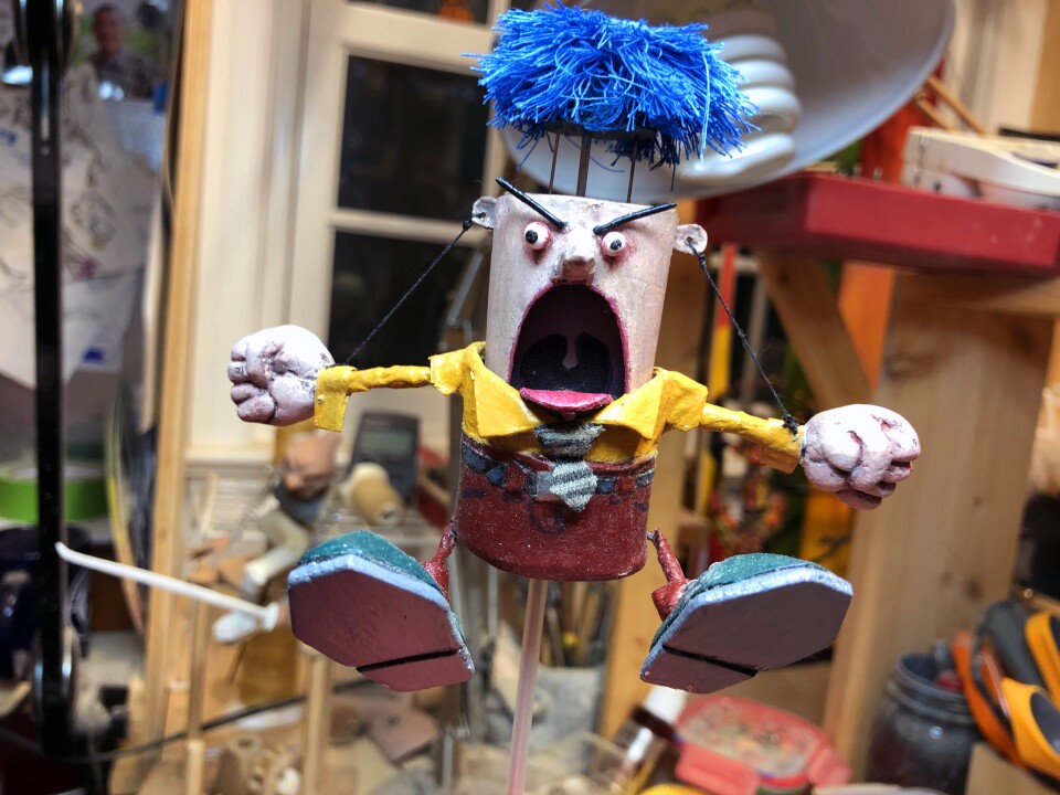Don Becker's "Angry Man" automaton slowly rises, shakes his fists and blows his wig off when you turn a crank.