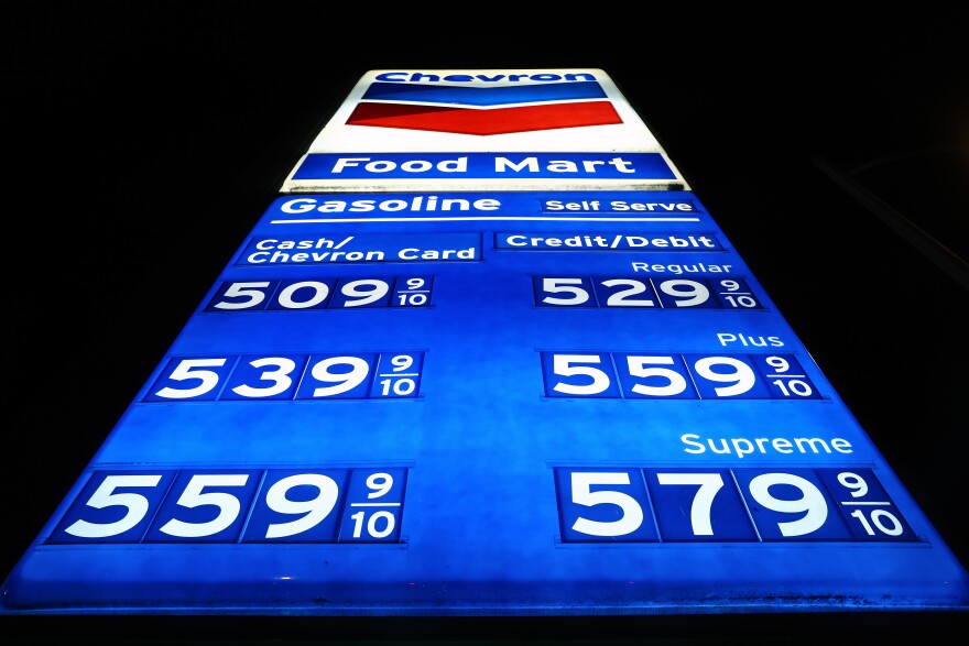 A lighted Chevron sign has a high of $5.79 9/10 per gallon for Supreme gasoline.
