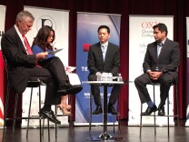 NBC4 commentator Conan Nolan, left, and Telemundo anchor Dunia Elvir moderate a forum featuring the two candidates running in the 34th Congressional District, Robert Ahn, second from right, and Jimmy Gomez, right.