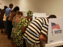 NORWALK, CA - OCTOBER 22:  Voters cast their ballots in early voting at the Los Angeles County Registrar of Voters office on October 22, 2008 in Norwalk, California. With less than two weeks left before the November 4 presidential election, early voting is underway in 31 states including California where Angelenos began casting their votes on October 6.  (Photo by David McNew/Getty Images)