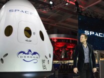 SpaceX CEO Elon Musk introduces SpaceX's Dragon V2 spacecraft, the company's next generation version of the Dragon ship designed to carry astronauts into space, at a press conference in Hawthorne, California on May 29, 2014.