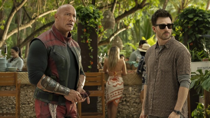 Dwayne Johnson and Chris Evans in character in the movie "Red One."