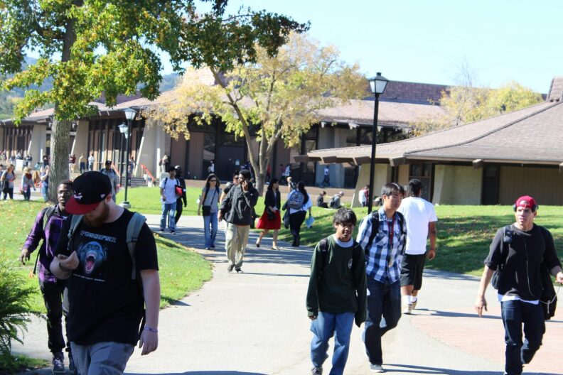 Students walk on a path at Foothill College.