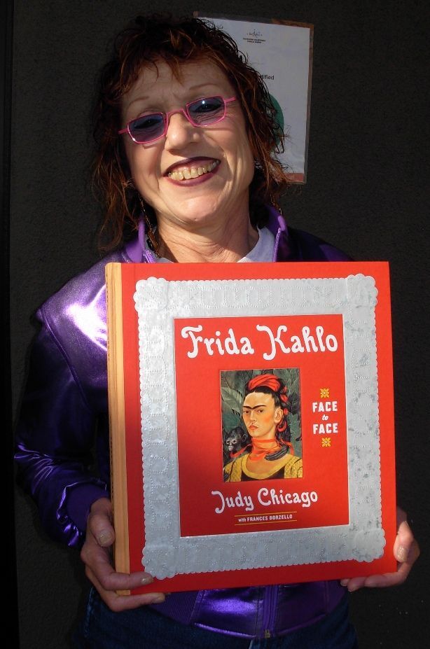 Artist Judy Chicago and her book.