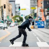 LOS ANGELES, CALIFORNIA - APRIL 08: A person in a face covering rollerblades on a crosswalk during the coronavirus pandemic on April 08, 2020 in Los Angeles, California. COVID-19 has spread to most countries around the world, claiming almost 70,000 lives with infections nearing 1.3 million people. (Photo by Rich Fury/Getty Images)