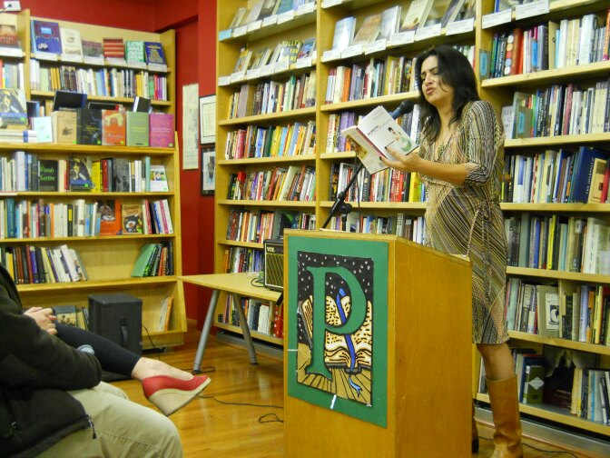 Author Michele Serros reads from one of her books at Pegasus Books in Berkeley in January 2012.