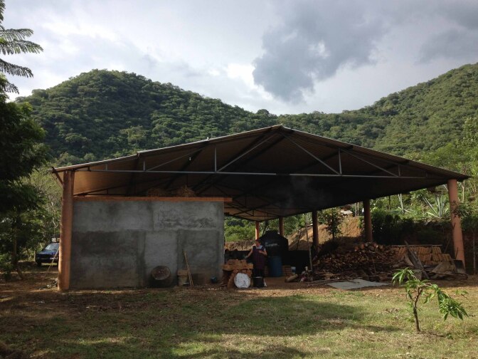 The 'palenque,' the workshop where they make mezcal, is at the bottom of the slopes the agave plants grow on.