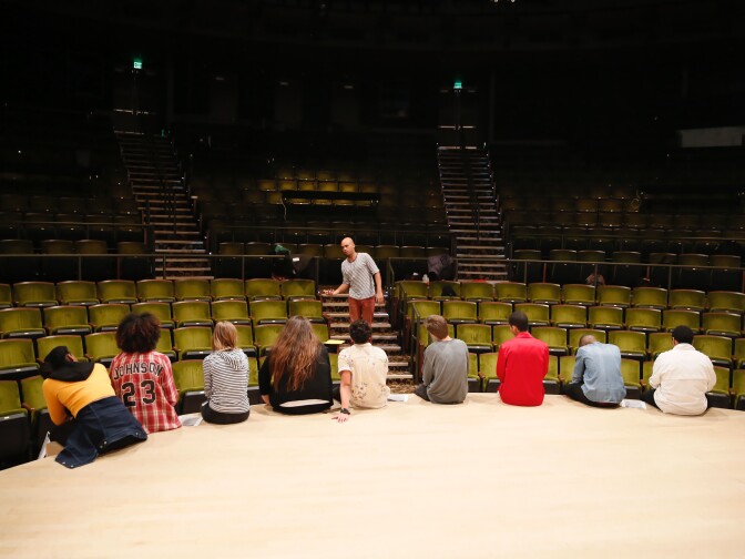 Teaching artist Jonathan Sims leads students in rehearsals. 
