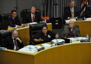 FILE - Los Angeles Unified School Board member Mónica García (center) speaks during a meeting, as colleagues George McKenna (left), Scott Schmerelson (right) and district staff (rear) listen.