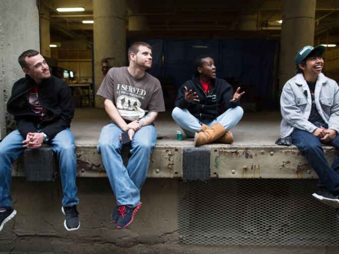 Paquita Hughes talks with other veterans about their common service during a break from shooting a public service announcement about veterans' issues.