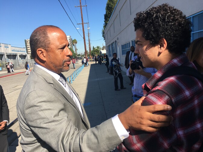 University of California, Irvine Vice Chancellor Thomas Parham, left, talks to Compton High School senior Anthony Ibarra about programs to help him get admitted to a U.C. campus.