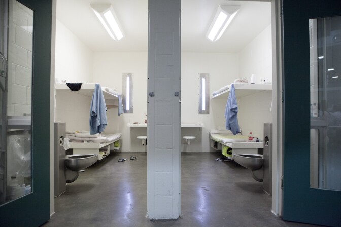 Two women occupy one cell at the Twin Towers Correctional Facility in downtown Los Angeles. Other women sleep in the common area on day beds due to overcrowding.