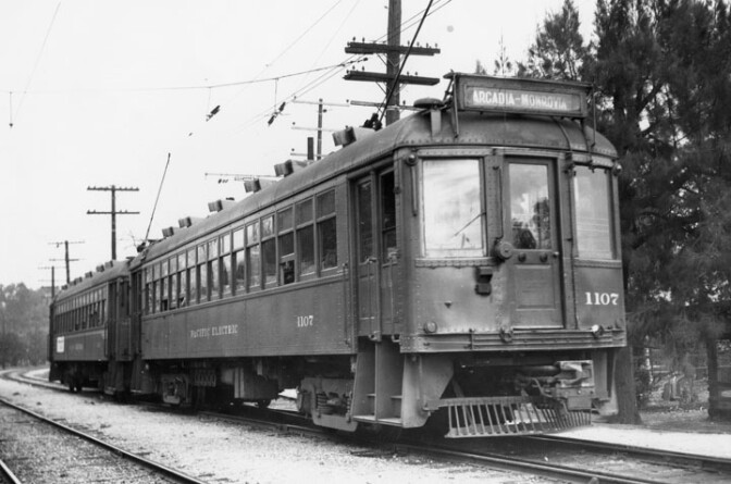 A double-long Pacific Electric Railway car travels on the Arcadia-Monrovia Line. 