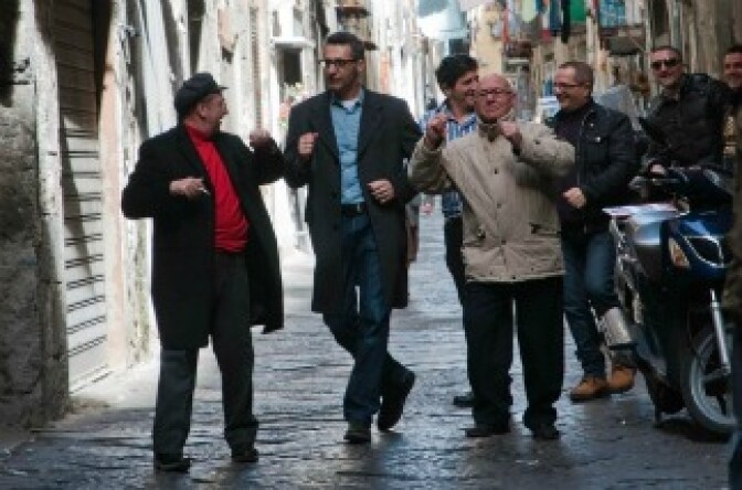 In Passione, Director John Turturro gets in front of the camera to dance with a few of the Neapolitans he meets on the street.
