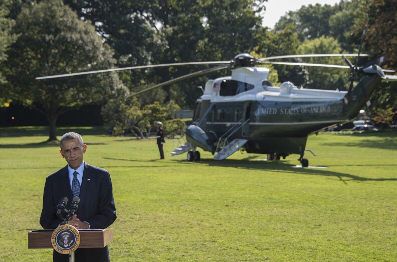 President Barack Obama delivers a statement on the first US bombing of the Islamic State group(IS) and Al-Qaeda at the White House in Washington, DC, September 23, 2014, before departing to attend the United Nations General Assembly in New York. President Obama said Tuesday the coalition of Arab nations involved in the first US air strikes in Syria, showed the United States was not alone in combating the Islamic State group. 