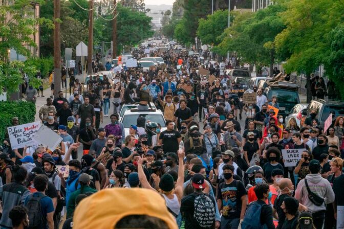 Protesters march through Hollywood after curfew during a demonstration over the death of George Floyd while in Minneapolis Police custody, in Los Angeles, California, June 2, 2020. - Anti-racism protests have put several US cities under curfew to suppress rioting, following the death of George Floyd in police custody. (Photo by Kyle Grillot / AFP) (Photo by KYLE GRILLOT/AFP via Getty Images)