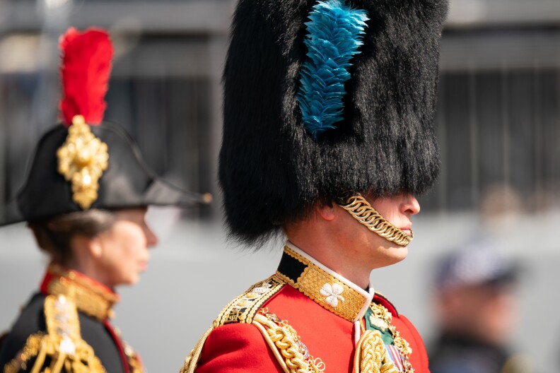 Prince William, Duke of Cambridge, in his role as Colonel of the Irish Guards, rides his horse along the Mall during the Royal Procession ahead of the Trooping the Color parade.