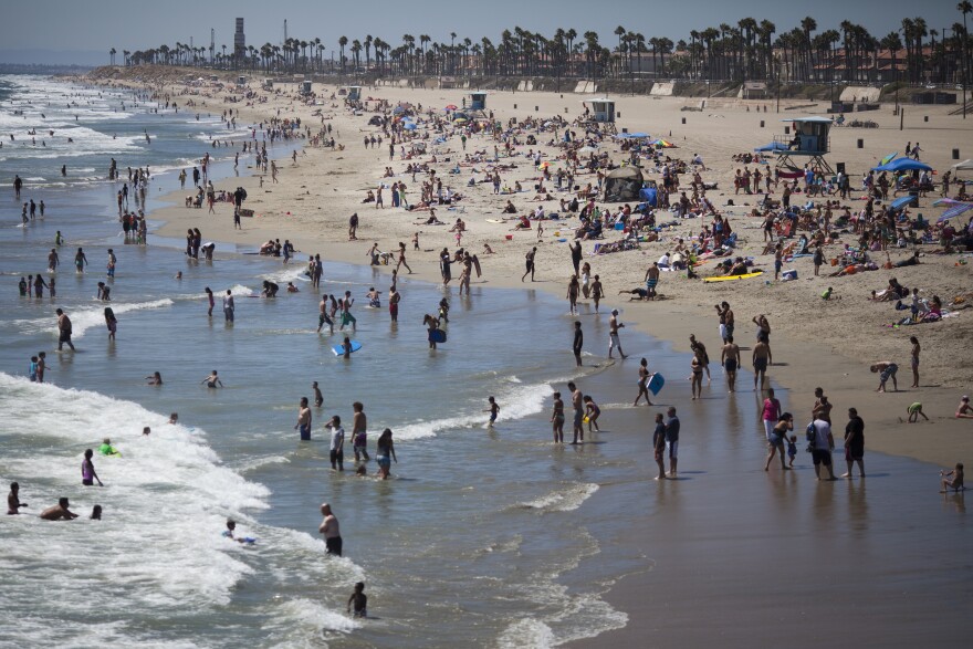 Huntington Beach is busy with beachgoers on a recent afternoon. The beach will host the U.S. Open of Surfing starting Saturday.