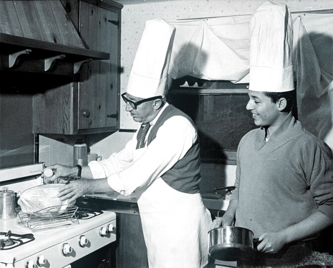 1964: John Cassidy and son, Cass, share cooking chores in their Chatsworth home