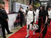 Guests, dressed in cosplay, arrive for the screening of "Star Wars: The Last Jedi" after the closing ceremony of the Dubai International Film Festival, in Dubai on December 13, 2017.