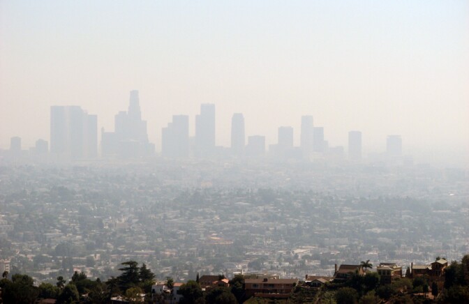 Smog blankets downtown Los Angeles. New low-cost air monitors allow people to know what air pollution is like not just in their city, but right outside their door. 