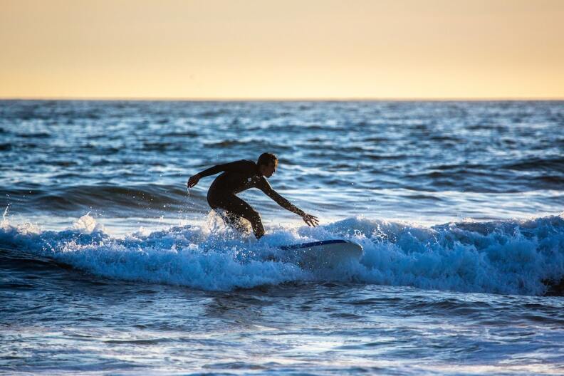 A man surfing in the ocean