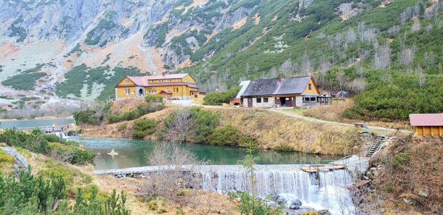Small houses nestled in a hillside along a river in Zdiar, Slovakia
