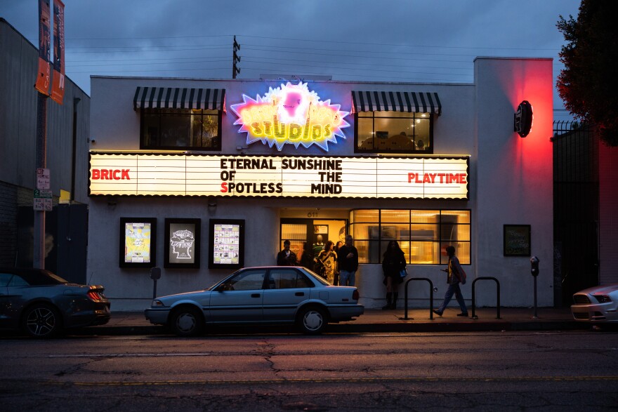 The glowing, lit exterior of a theater marquee.