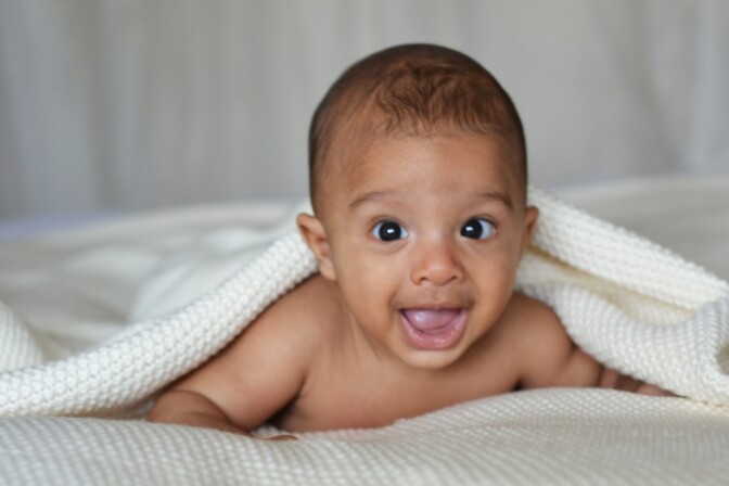 he always trys to hide his face when he smiles but i caught a glimpse of it before he hid this time