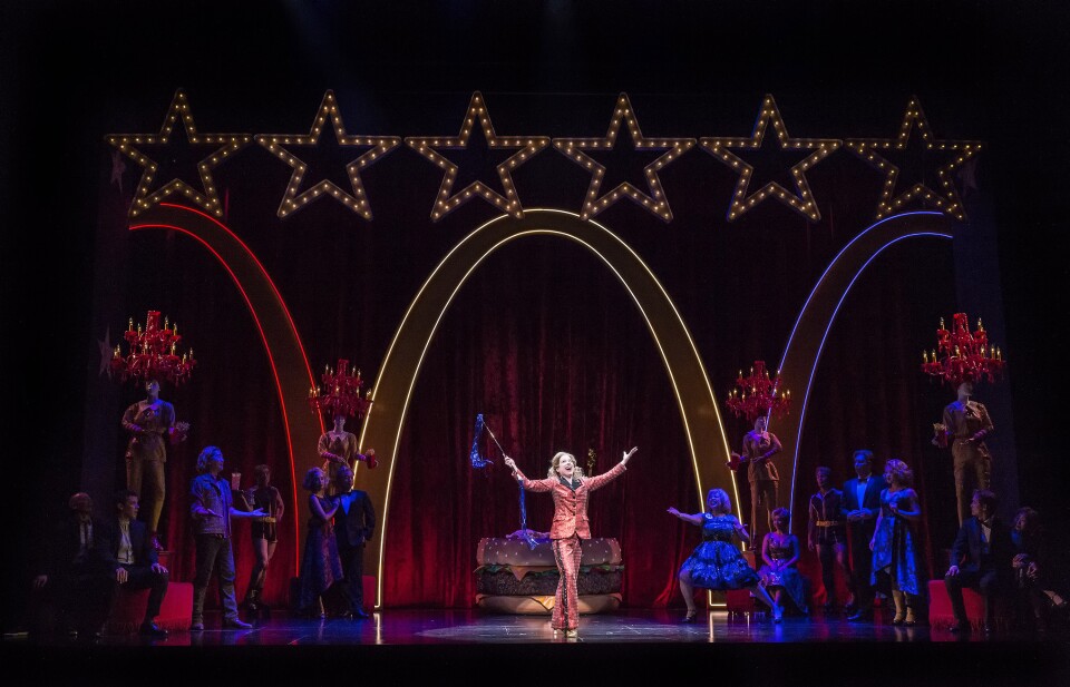 In "Soft Power," a Chinese executive visiting America finds himself falling in love with US leader Hillary Clinton, played by Alyse Alan Louis.