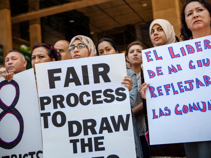 Anaheim resident, Rabiya Shakil (center), 20, stands with other community members during a July 31, 2012 press conference calling for city leaders to address a lack of Latino and minority representation in City Hall.