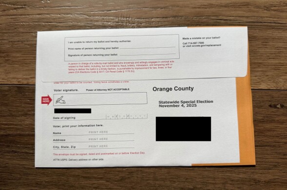 The back of an Orange County mail-in ballot return envelope. There are no holes. 