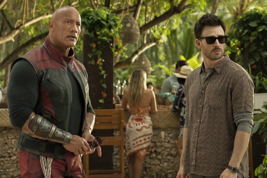 Dwayne Johnson and Chris Evans in character in the movie "Red One."
