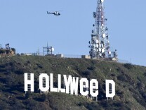File: The famous Hollywood sign reads "Hollyweed" after it was vandalized, January 1, 2017. 