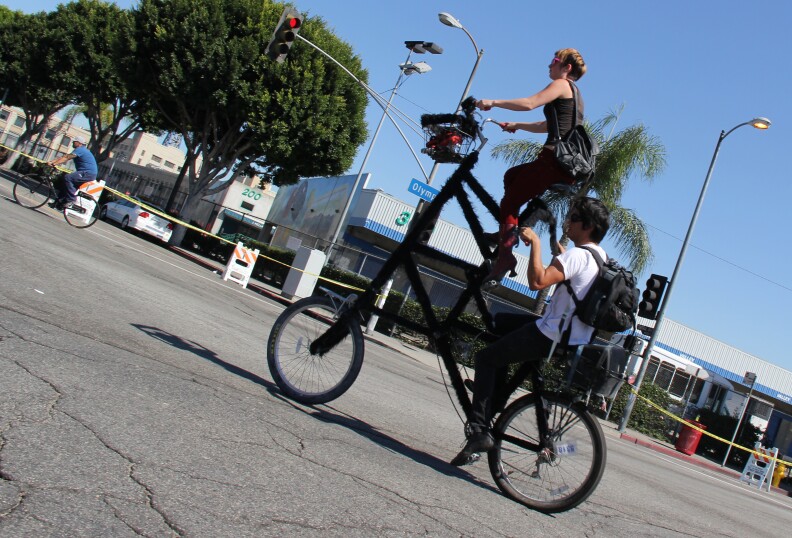 A double decker bike turns onto 9th Street at L.A.'s third CicLAvia event on October 9, 2011.