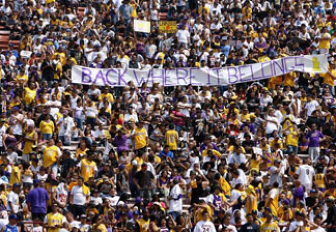 Fans of the Los Angeles Lakers cheer during the 2009 NBA Championship Victory Parade and Rally at the Los Angeles Memorial Coliseum on June 17, 2009 in Los Angeles, California. This year's parade is expected to bring tens of thousands downtown.
