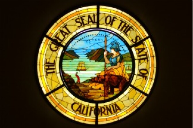 The California State Seal rendered in a stained glass window.