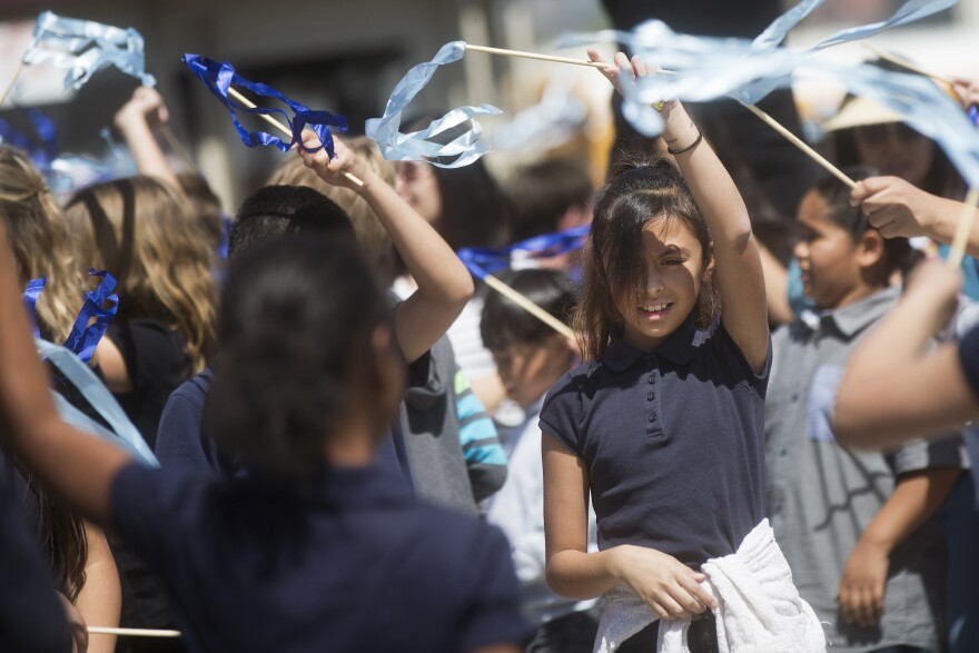 Students from Roosevelt Elementary in Pasadena take part in setting the Guinness World Records Title for the largest ribbon dance on Thursday, April 9, 2015 at The Music Center Plaza. 