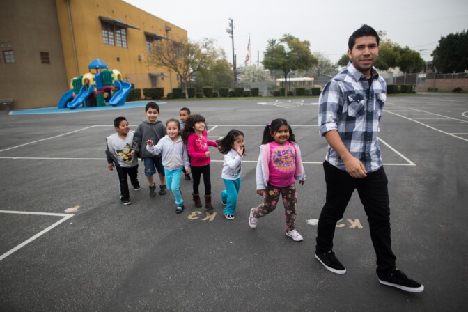 Marvin Curiel, an assistant teacher, leads a group of students in the transitional kindergarten program at the Martha Escutia Primary Center.