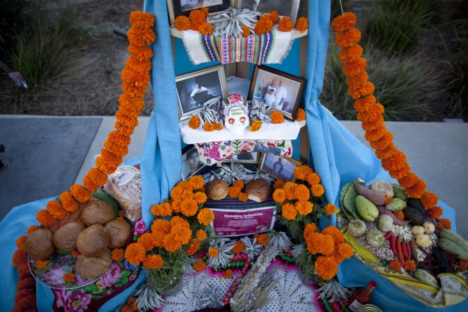 This Dia de los Muertos altar in Grand Park, titled "For the Homies," is dedicated to male and female gang members who turned their lives around, often through Homeboy Industries.